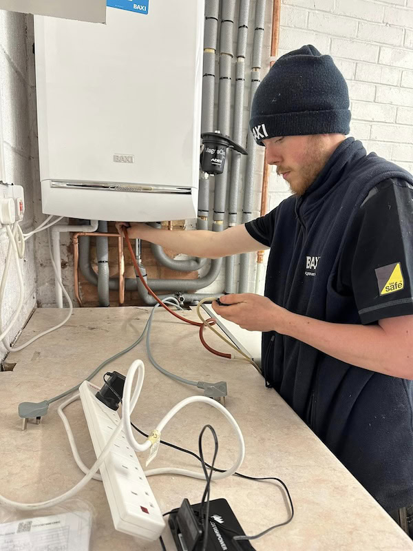 Gas Safe engineer servicing a boiler